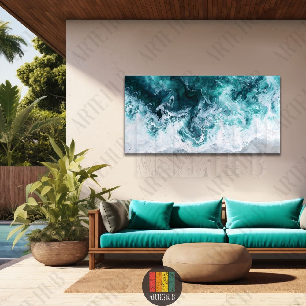 Modern abstract canvas wall art featuring turquoise ocean waves and sea foam displayed in a luxury outdoor lounge setting.