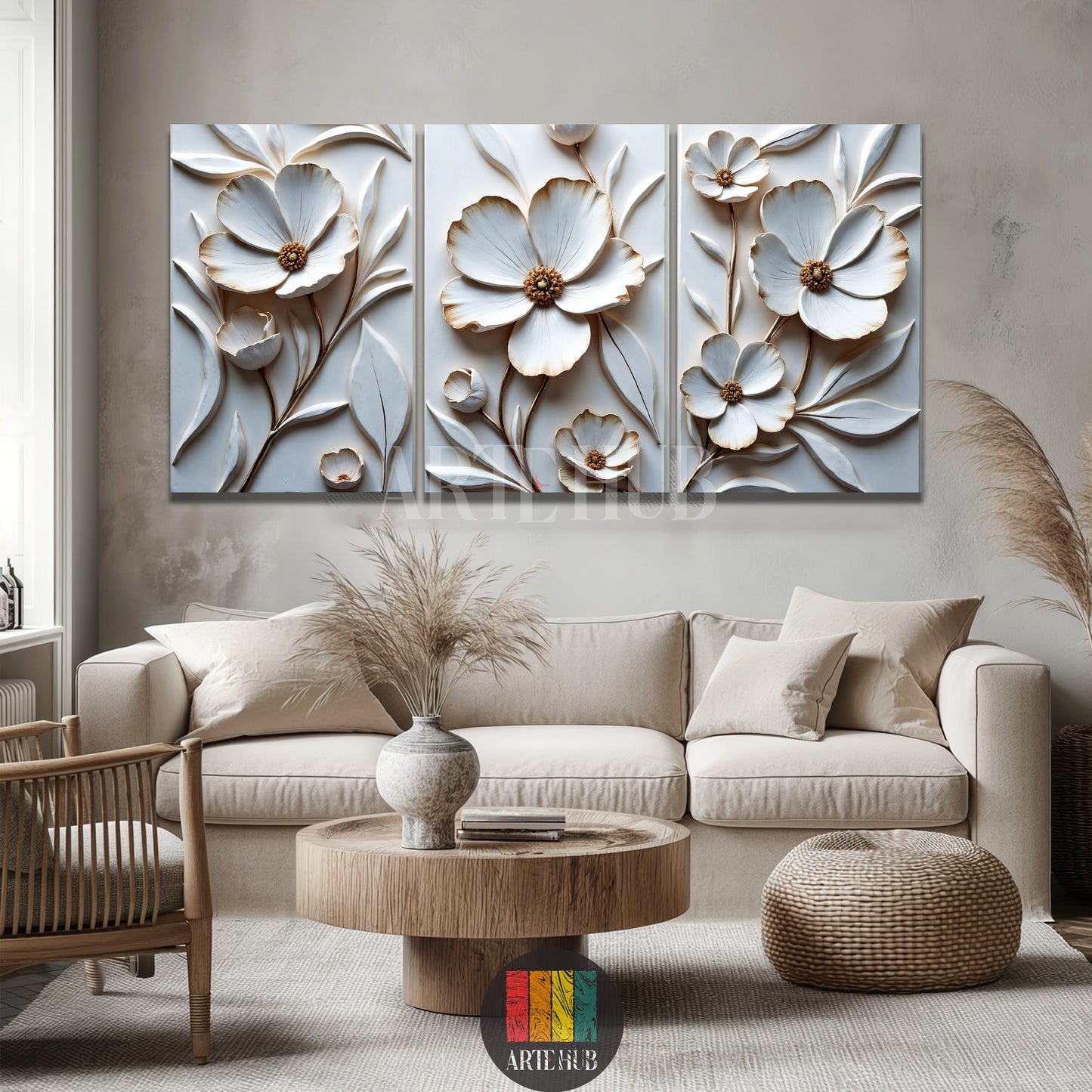A luxurious three-piece set of 3D white and gold floral canvas wall art by Artehub, displayed over a modern bed in an Egyptian home styling.

 مجموعة من ثلاث لوحات كانفاس بزهور بيضاء وذهبية بارزة ثلاثية الأبعاد من Artehub، معلقة فوق سرير في ديكور غرفة نوم عصرية داخل مصر.
