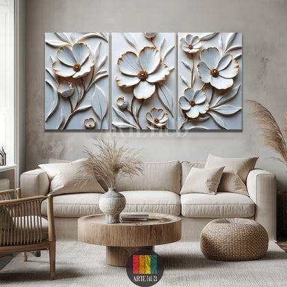 A luxurious three-piece set of 3D white and gold floral canvas wall art by Artehub, displayed over a modern bed in an Egyptian home styling.

 مجموعة من ثلاث لوحات كانفاس بزهور بيضاء وذهبية بارزة ثلاثية الأبعاد من Artehub، معلقة فوق سرير في ديكور غرفة نوم عصرية داخل مصر.