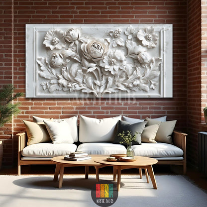 A large white 3D floral relief wall art canvas hanging above a modern sofa against a brick wall in an Egyptian living room, adding elegance and depth.
تابلوه حائط كبير أبيض بتصميم أزهار ثلاثي الأبعاد معلق فوق أريكة عصرية على جدار من الطوب في غرفة معيشة مصرية، يضيف أناقة وعمقاً للمكان.