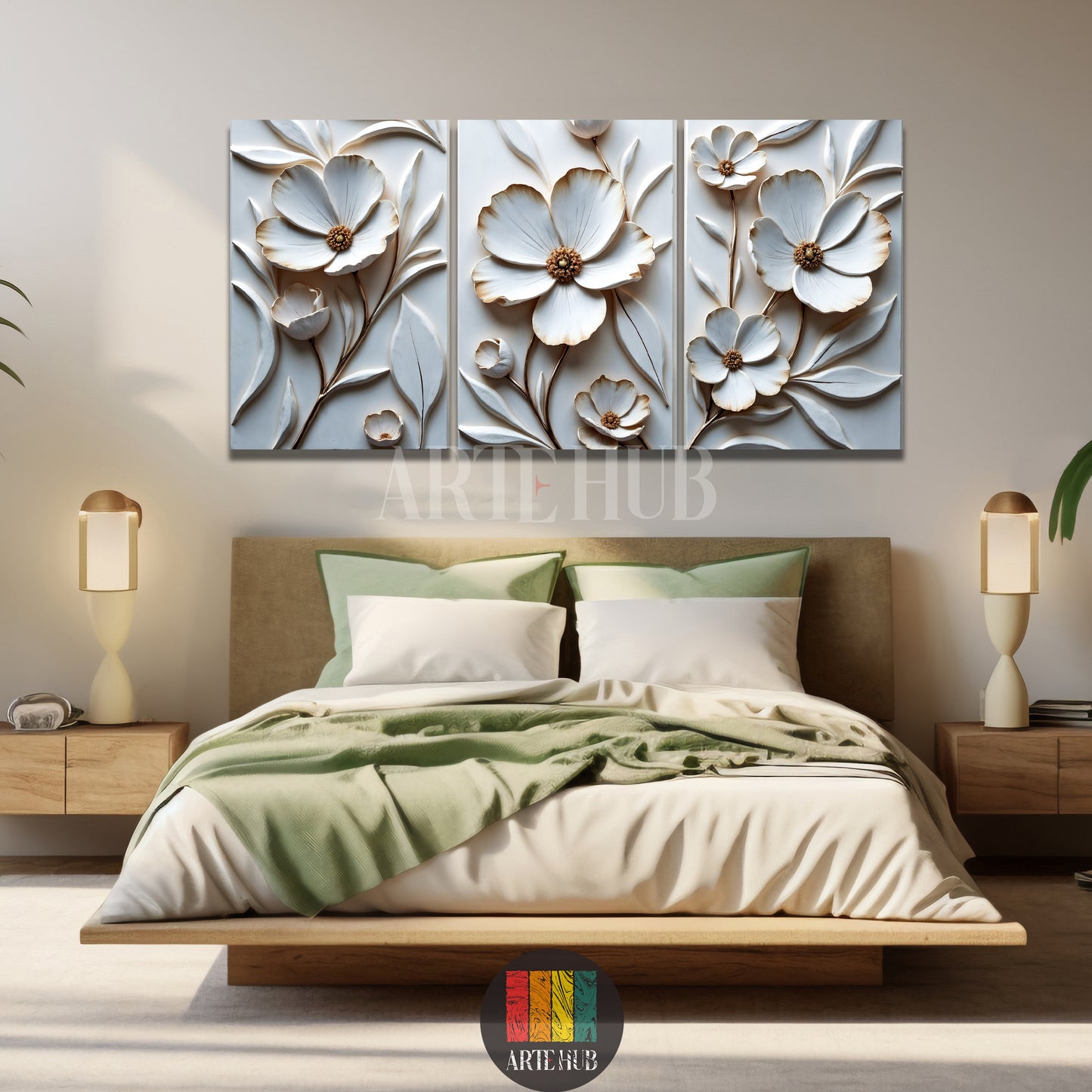 A luxurious three-piece set of 3D white and gold floral canvas wall art by Artehub, displayed over a modern bed in an Egyptian home styling.

 مجموعة من ثلاث لوحات كانفاس بزهور بيضاء وذهبية بارزة ثلاثية الأبعاد من Artehub، معلقة فوق سرير في ديكور غرفة نوم عصرية داخل مصر.