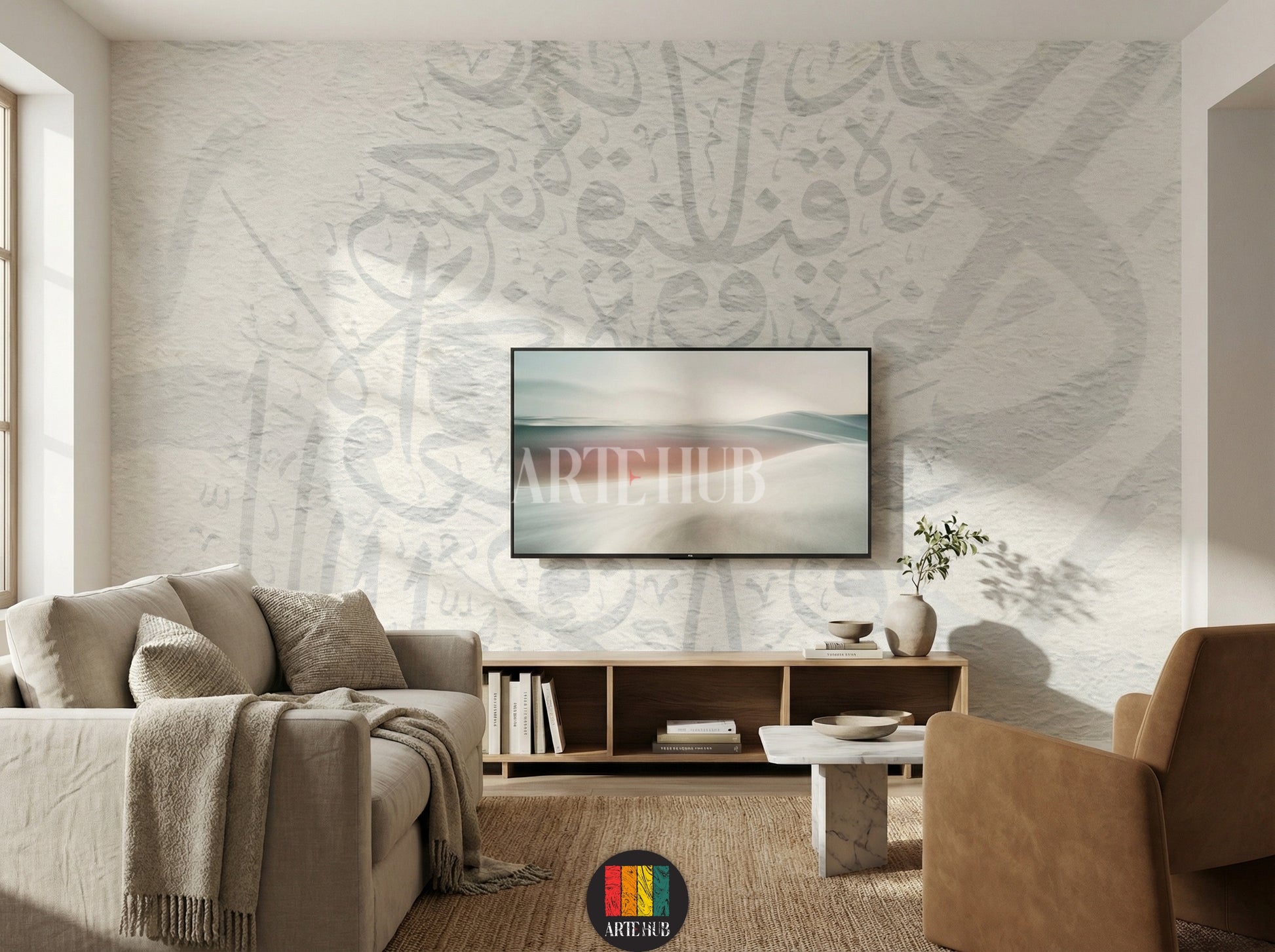 Full view of a modern tv room featuring light, textured wallpaper with subtle Khatt Arabic calligraphy patterns. The room includes a wooden dining table, cream boucle chairs, a light rug, a unique pendant lamp, and a minimalist side cabinet with vases, enhancing contemporary home decor in Egypt.
صورة كاملة لغرفة عصرية تتميز بورق حائط ذو ملمس خفيف ونقوش خط عربي رقيقة. تحتوي الغرفة على طاولة طعام خشبية، كراسي قماش باللون الكريمي، سجادة فاتحة 
room: tv