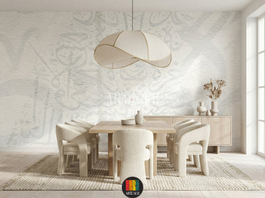 Full view of a modern dining room featuring light, textured wallpaper with subtle Khatt Arabic calligraphy patterns. The room includes a wooden dining table, cream boucle chairs, a light rug, a unique pendant lamp, and a minimalist side cabinet with vases, enhancing contemporary home decor in Egypt.
صورة كاملة لغرفة طعام عصرية تتميز بورق حائط ذو ملمس خفيف ونقوش خط عربي رقيقة. تحتوي الغرفة على طاولة طعام خشبية، كراسي قماش باللون الكريمي، سجادة فاتحة 
room: dining room