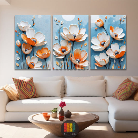  A beautiful triptych set of three canvas paintings featuring textured white and orange flowers on a blue background, ideal for Egyptian style home decor from Artehub.

 طقم تابلوهات من ثلاث قطع يضم زهوراً بارزة باللونين البرتقالي والأبيض على خلفية زرقاء، مثالي لتنسيق الديكور في مصر من آرت هاب.