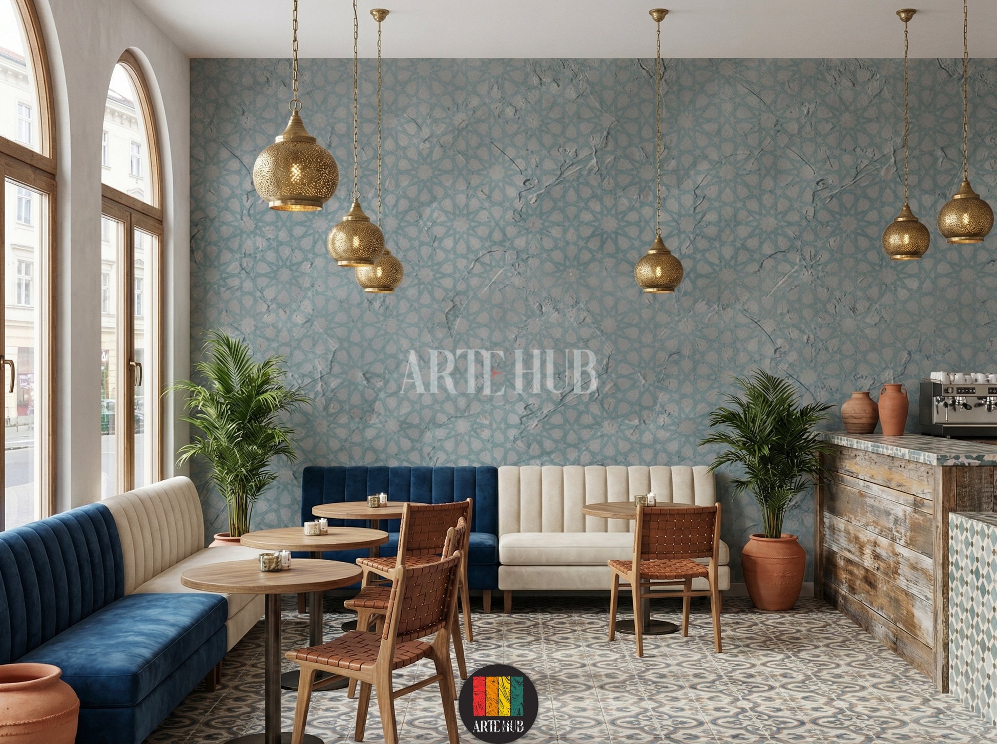 Full view of a modern cafe featuring a light blue and grey geometric textured wallpaper with an Islamic pattern. A white sofa with grey pillows, a white coffee table with candles and decor, and modern black pendant lights are visible. Ideal for contemporary home decor in Egypt.
صورة كاملة لكافية عصرية بها ورق حائط مزخرف بنقوش هندسية إسلامية باللون الأزرق الفاتح والرمادي. تظهر كنبة بيضاء بوسائد رمادية، طاولة قهوة بيضاء مع شموع وديكور، وإضاءة معلقة حديثة. 
room: cafe 