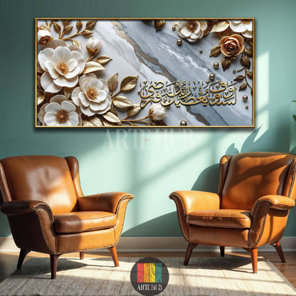 A luxurious horizontal canvas print featuring 3D-effect gold metallic floral elements and white flowers on a grey marble background with gold veins. Islamic calligraphy in gold is centered. The artwork is framed in gold, displayed on a mint green wall above two brown leather armchairs, enhancing modern Egyptian living room decor.
تابلوه كانفاس أفقي فاخر بتصميم ثلاثي الأبعاد لزهور ذهبية وبيضاء متفتحة على خلفية رخامية رمادية وعروق ذهبية، تتوسطه خطوط عربية إسلامية باللون الذهبي. محاط بإطار ذهبي ومعلق على حائط 