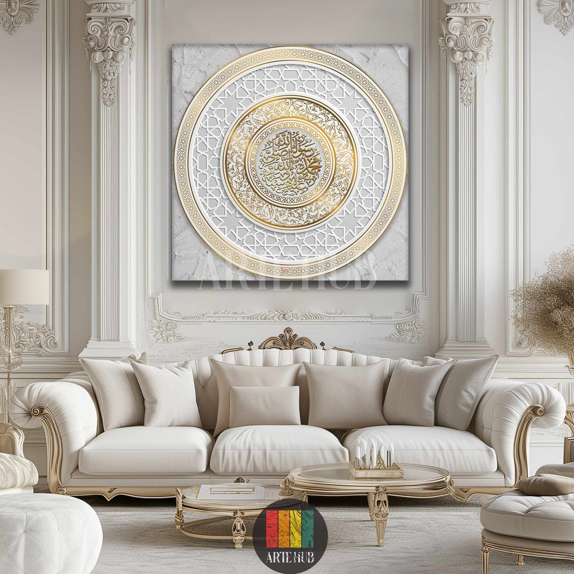 A large square canvas featuring intricate golden Islamic calligraphy of 'Muhammad Rasul Allah' within a circular geometric pattern, displayed above a luxurious cream sofa in a neoclassical Egyptian living room.
تابلوه كانفس مربع كبير بتصميم فن إسلامي فاخر بخط عربي 'محمد رسول الله' ونقوش هندسية ذهبية، معروض فوق كنبة كريمة فخمة في غرفة معيشة عصرية في مصر.