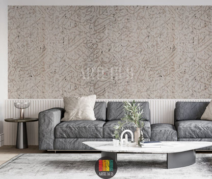 Detailed view of a modern living room wall adorned with light beige textured wallpaper featuring abstract Arabic calligraphy. A stylish grey sofa, a white marble coffee table, and a grey side table complete the contemporary Egyptian interior decor.
منظر تفصيلي لجدار غرفة معيشة عصرية مزين بورق حائط بيج فاتح بنقوش خط عربي تجريدي. تظهر كنبة رمادية أنيقة وطاولة قهوة رخامية بيضاء وطاولة جانبية رمادية لتكمل الديكور الداخلي العصري في مصر.
room: living room
