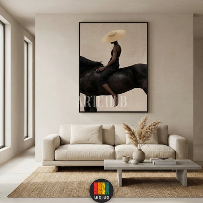  A minimalist modern canvas from Artehub featuring a woman in a straw hat riding a black horse, perfect for wall art in Egypt and contemporary home decor.

 تابلوه كانفاس مودرن من Artehub يصور امرأة ترتدي قبعة تركب حصاناً أسود، مثالي لديكور الحائط في مصر ولمحبي الخيل.