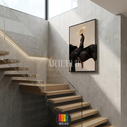  A minimalist modern canvas from Artehub featuring a woman in a straw hat riding a black horse, perfect for wall art in Egypt and contemporary home decor.

 تابلوه كانفاس مودرن من Artehub يصور امرأة ترتدي قبعة تركب حصاناً أسود، مثالي لديكور الحائط في مصر ولمحبي الخيل.