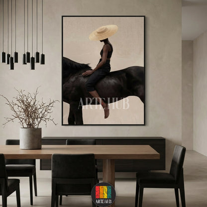 A minimalist modern canvas from Artehub featuring a woman in a straw hat riding a black horse, perfect for wall art in Egypt and contemporary home decor.

 تابلوه كانفاس مودرن من Artehub يصور امرأة ترتدي قبعة تركب حصاناً أسود، مثالي لديكور الحائط في مصر ولمحبي الخيل.