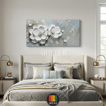 A large rectangular canvas wall art by Artehub featuring two 3D textured white blossoms on a minimalist grey and gold background, styled for an elegant living room in Egypt.

لوحة كانفاس كبيرة من Artehub تضم زهوراً بيضاء بارزة بتصميم ثلاثي الأبعاد على خلفية رمادية وذهبية، مناسبة لديكورات المنازل الفاخرة في مصر.