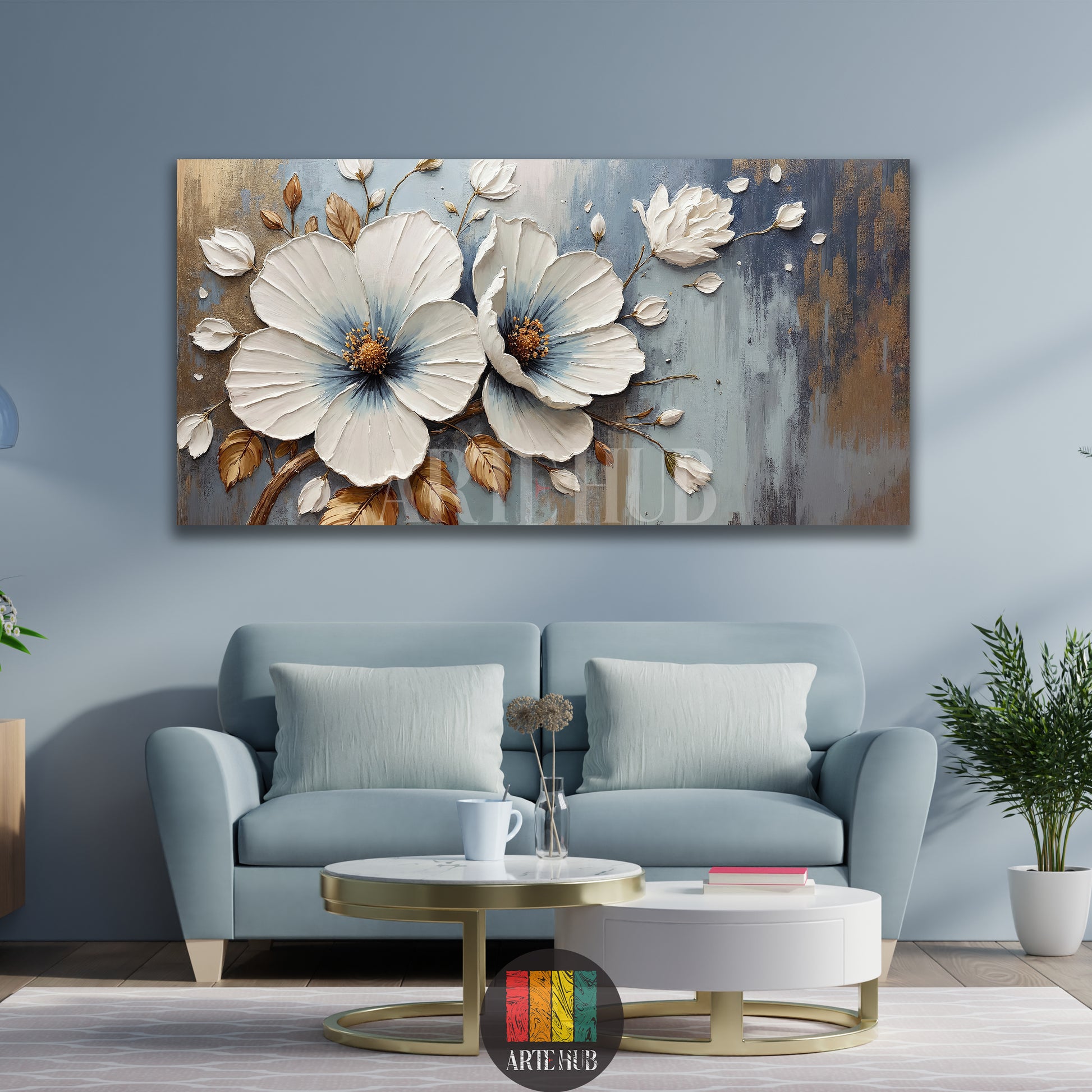  A sophisticated 3D textured white floral wall art canvas with gold and blue accents, styled over a light blue sofa by Artehub, perfect for home decoration in Egypt.

 تابلوه ورد أبيض بارز بتصميم مودرن مع لمسات ذهبية وزرقاء لديكور الحوائط من Artehub، متاح للتوصيل في مصر لغرف المعيشة الفاخرة.