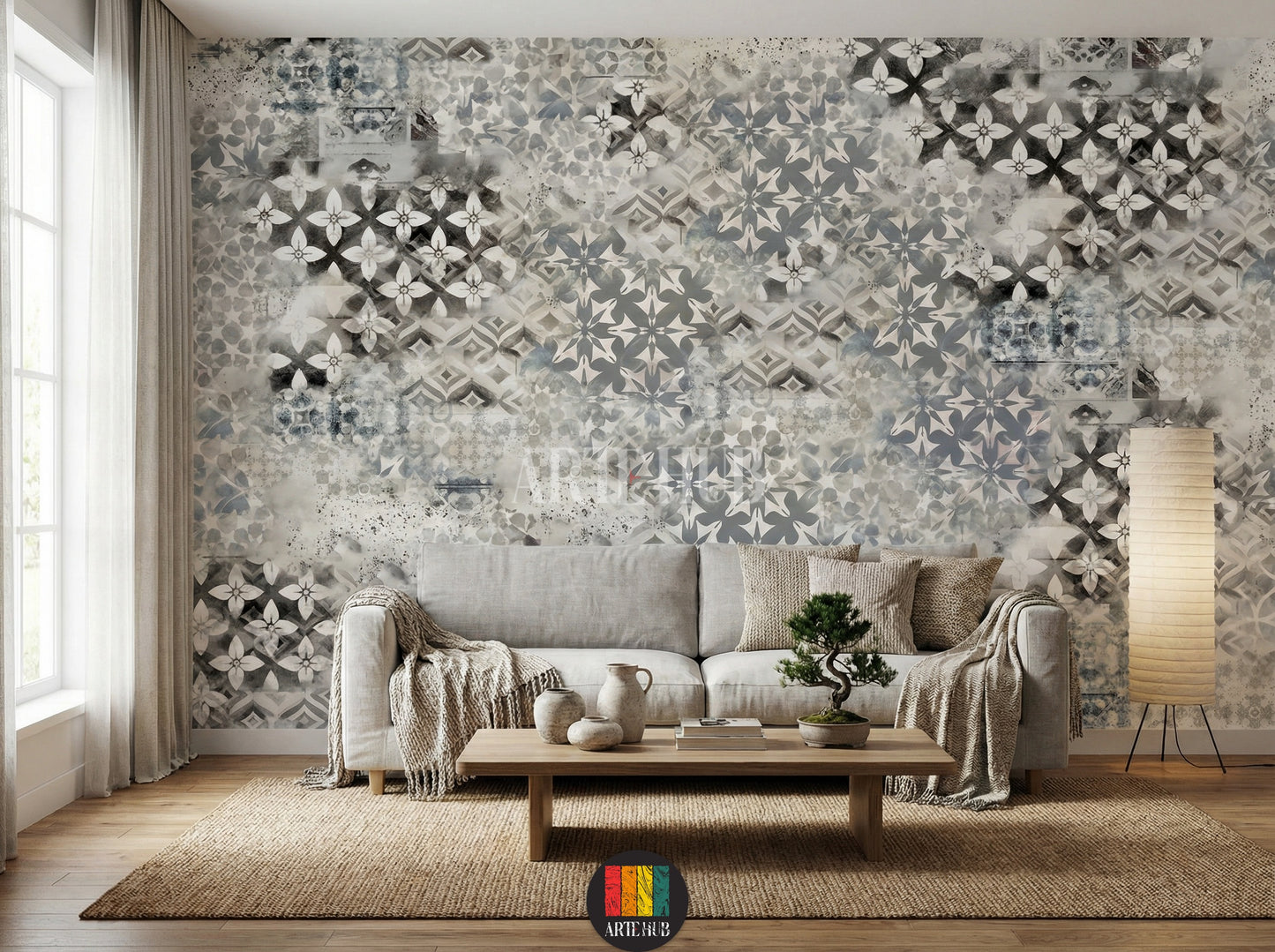 Full view of a living room featuring a modern, distressed grey and white patterned wallpaper (Mosaic Fusion design) with geometric and floral motifs. A wooden dining table with beige chairs, a woven pendant light, and a natural fiber rug complete the stylish home decor in Egypt.
مشهد كامل لغرفة معيشة بديكور عصري يضم ورق حائط رمادي وأبيض بنمط موزاييك وورود متداخلة (تصميم فيوجن). طاولة طعام خشبية مع كراسي بيج، إضاءة معلقة من الخوص، وسجادة من الألياف الطبيعية تزين الديكور 
room: living room