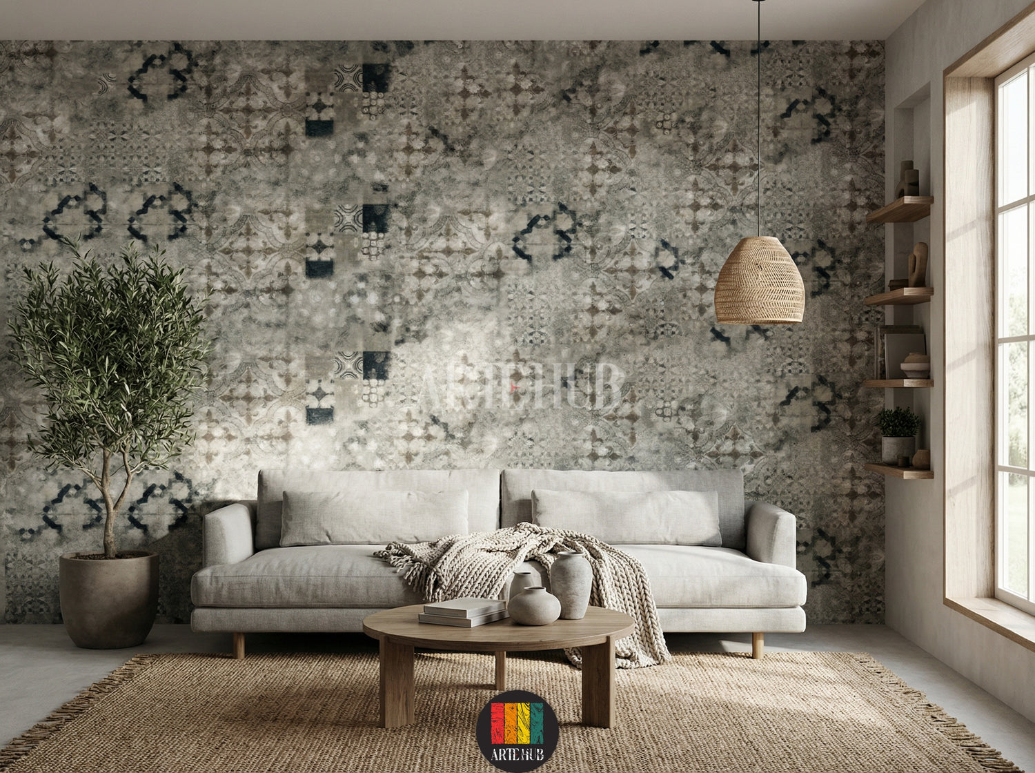 A stylish living room featuring Souk-patterned wallpaper with intricate geometric and abstract designs. A light grey sofa, round wooden coffee table, woven pendant lamp, and a large potted olive tree complete the bohemian-inspired decor in an Egyptian home.
صورة لغرفة معيشة أنيقة تتميز بورق حائط بنمط سوق بنقوش هندسية وتجريدية. يتوسط الغرفة كنبة رمادية فاتحة، طاولة قهوة خشبية مستديرة، ومصباح معلق من الخوص، وشجرة زيتون كبيرة في وعاء، لتكتمل الأجواء البوهيمية العصرية في منزل مصري.
room: living room