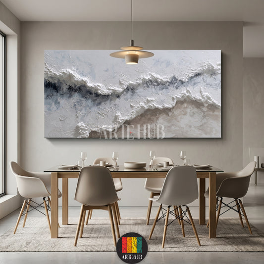 A large horizontal textured 3D abstract canvas wall art featuring white and blue waves hung above a modern dining room table in Egypt.