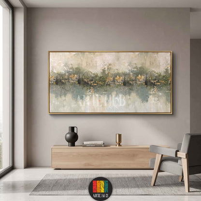 Horizontal abstract canvas wall art featuring misty green tones and gold leaf accents in a sleek gold frame, perfect for luxury home decor in Egypt.