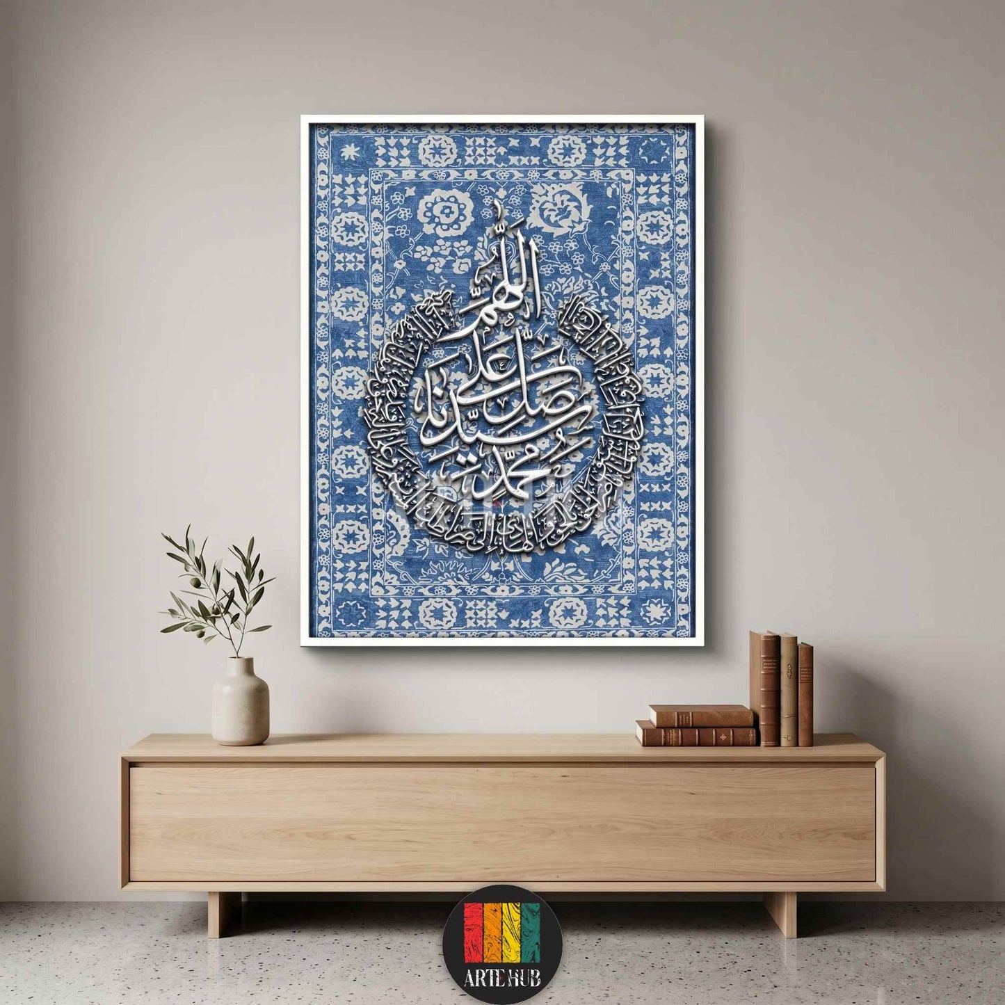 Luxury canvas wall art featuring white 3D Arabic calligraphy on a blue patterned background, framed modern Islamic home decor for a minimalist living room in Egypt.
