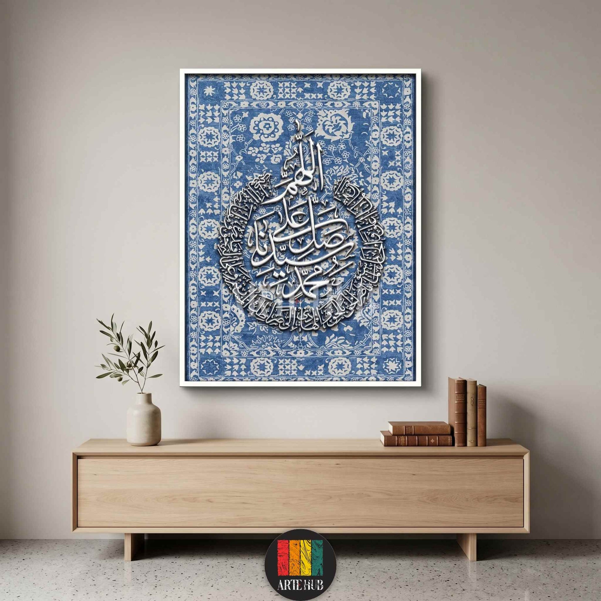 Luxury canvas wall art featuring white 3D Arabic calligraphy on a blue patterned background, framed modern Islamic home decor for a minimalist living room in Egypt.