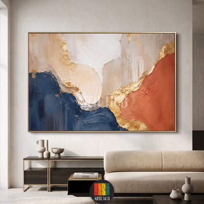 A large horizontal abstract canvas wall art featuring textured navy blue, terracotta, and cream waves with premium gold leaf accents in a modern living room.