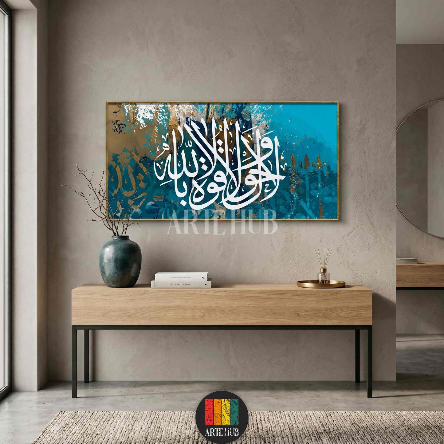 Modern Arabic calligraphy canvas wall art featuring white spiritual script over an abstract teal and gold background in a minimalist living room.