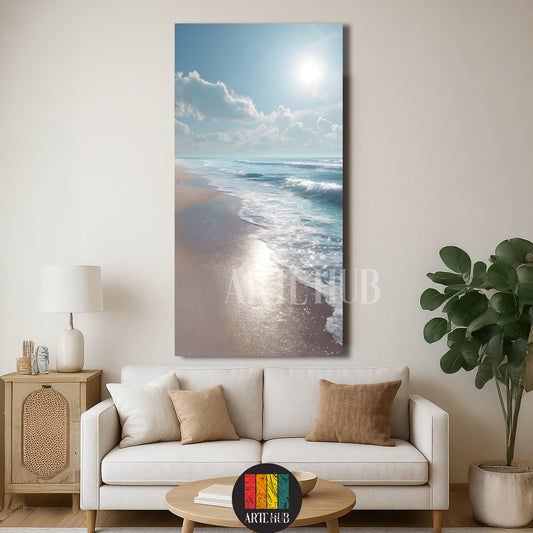 Vertical coastal canvas wall art depicting a sunny beach with sparkling waves and blue sky in a modern living room setting.