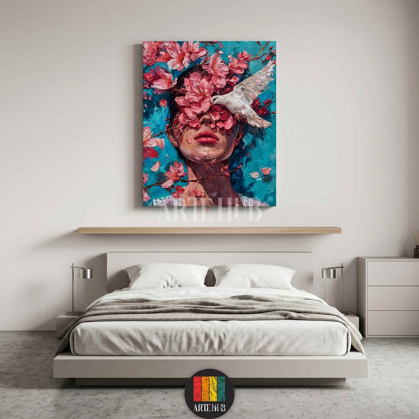 Artistic canvas wall art of a woman's face with pink blossoms and a white bird over a blue background for modern luxury decor.