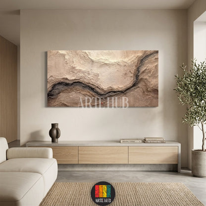 A panoramic textured canvas wall art piece featuring organic beige and dark brown topographical patterns in a luxury minimalist interior.