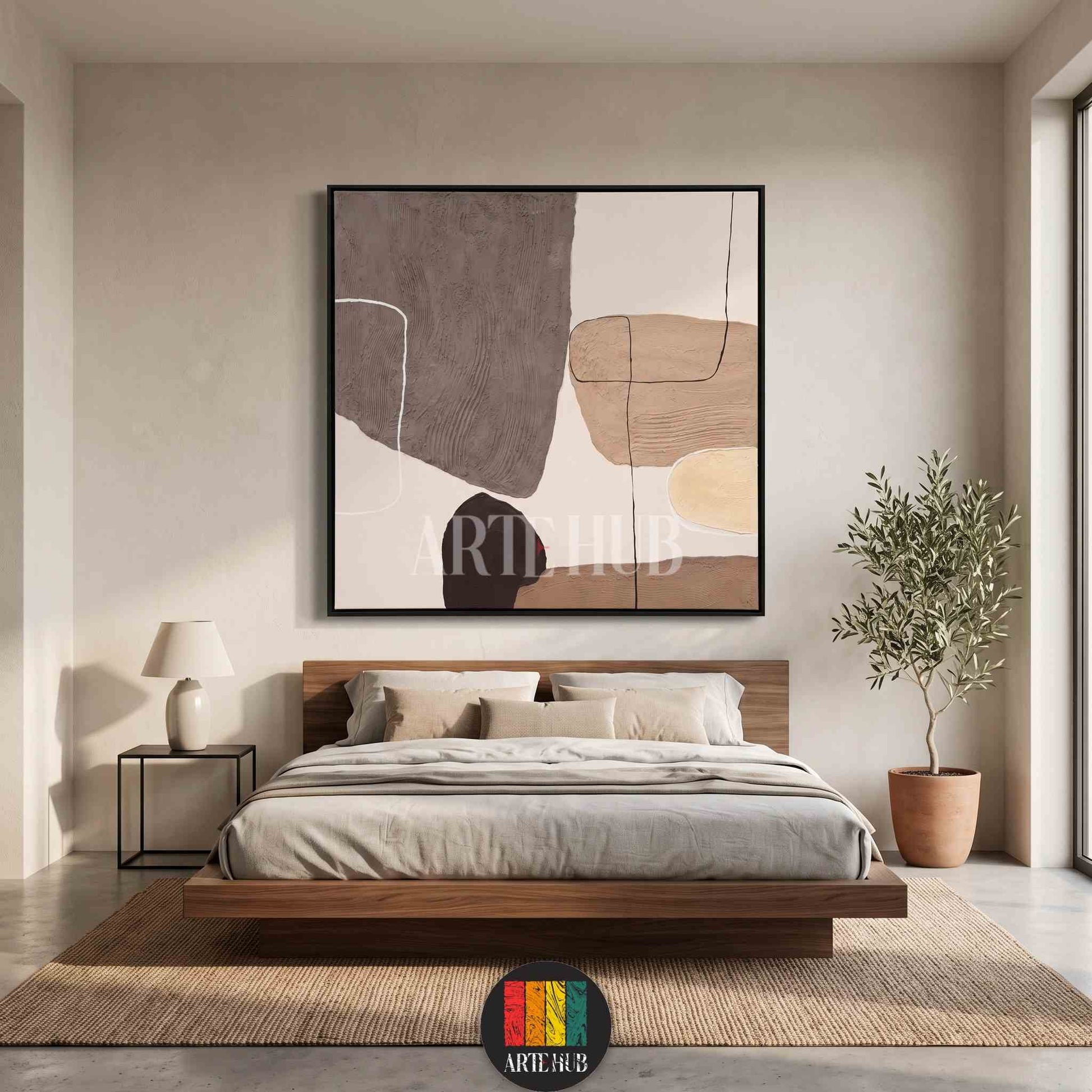 Minimalist abstract canvas wall art featuring textured organic shapes in earthy tones of beige and grey, perfect for luxury bedroom decor in Egypt.