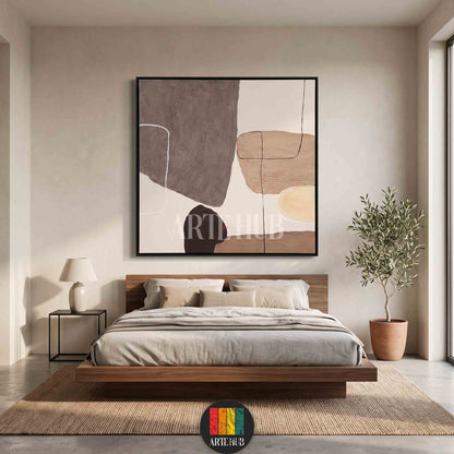 Minimalist abstract canvas wall art featuring textured organic shapes in earthy tones of beige and grey, perfect for luxury bedroom decor in Egypt.