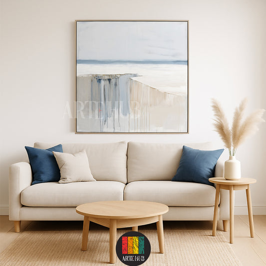 A large square abstract canvas wall art with soothing blue and beige tones hanging above a modern living room sofa in a premium Egyptian home.