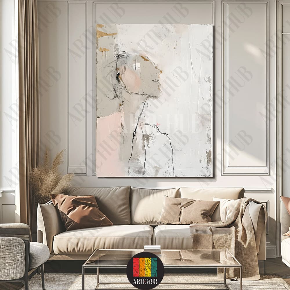 A premium abstract canvas wall art piece depicting a minimalist female silhouette in blush and gold tones, styled in a luxury modern living room in Egypt.