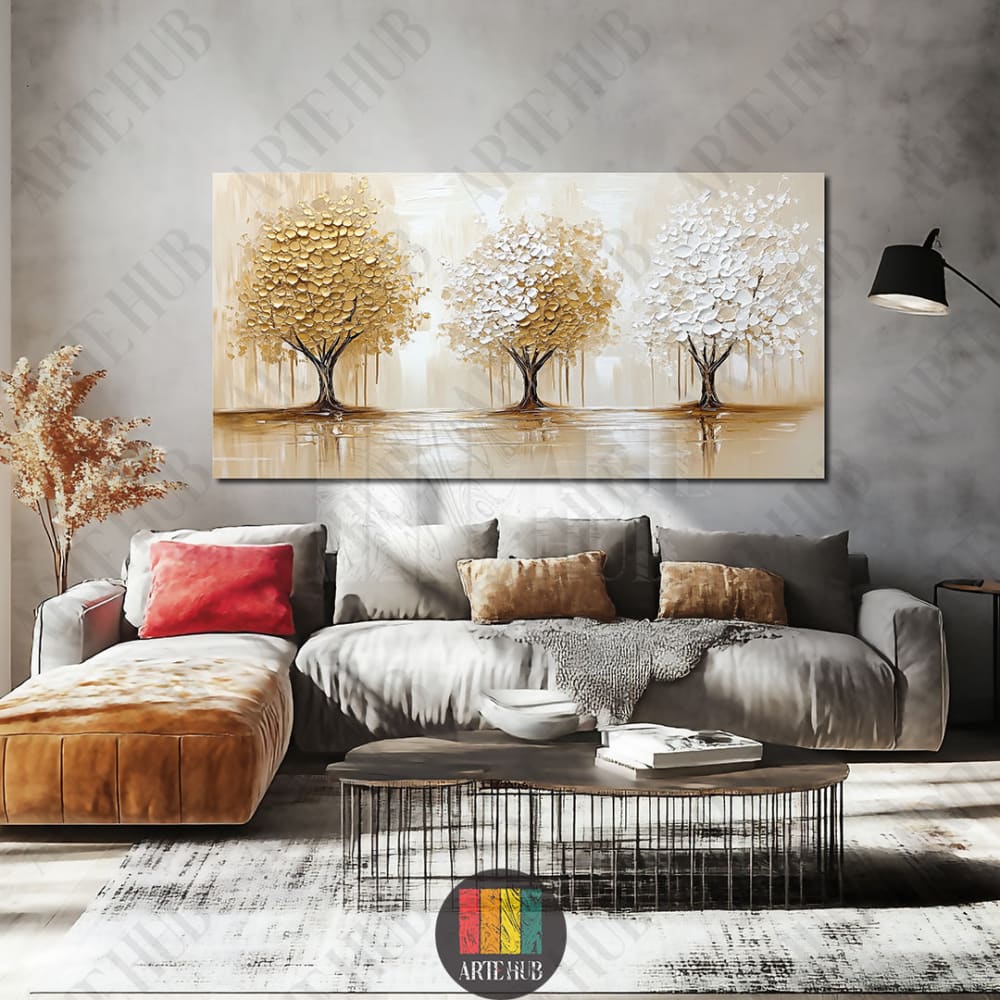 A large modern canvas wall art with three textured gold and white trees on a neutral background, styled in a luxury Egyptian living room setting.