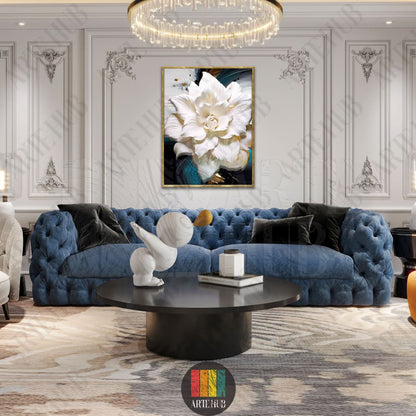 A premium canvas wall art piece showing a detailed white flower with gold splashes, displayed in a luxury living room setting in Egypt.