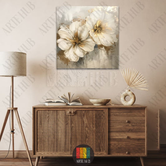 A square canvas painting featuring abstract white flowers with gold foil accents, styled in a minimalist interior in Egypt.