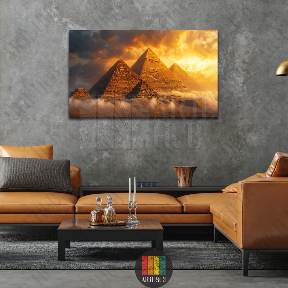 Luxury canvas wall art featuring the Great Pyramids of Giza at sunset with golden clouds and mist, displayed in a modern living room setting in Egypt.
