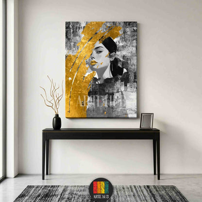 Modern grayscale portrait of a woman with a large metallic gold brushstroke on a textured background, styled as canvas wall art in a luxury living room.