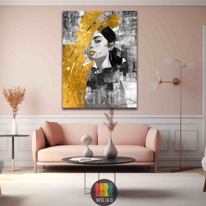 A modern vertical canvas wall art featuring a black and white female portrait accented with a bold gold paint stroke in a luxury living room in Egypt.