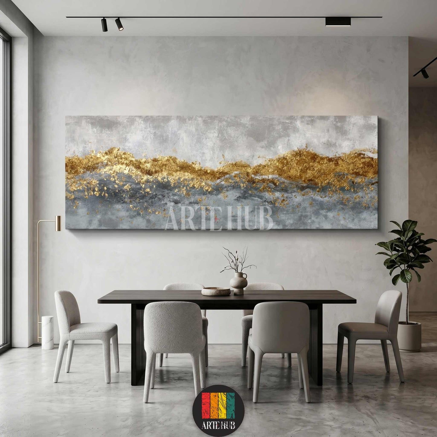 A luxurious panoramic abstract canvas wall art featuring metallic gold leaf textures and grey brushstrokes, styled in a modern minimalist dining room.
