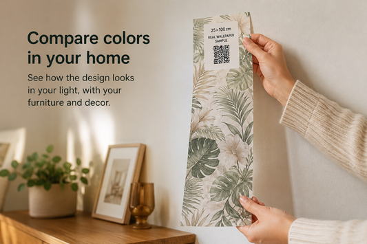 Person holding a wallpaper sample with leaf pattern in a room setting