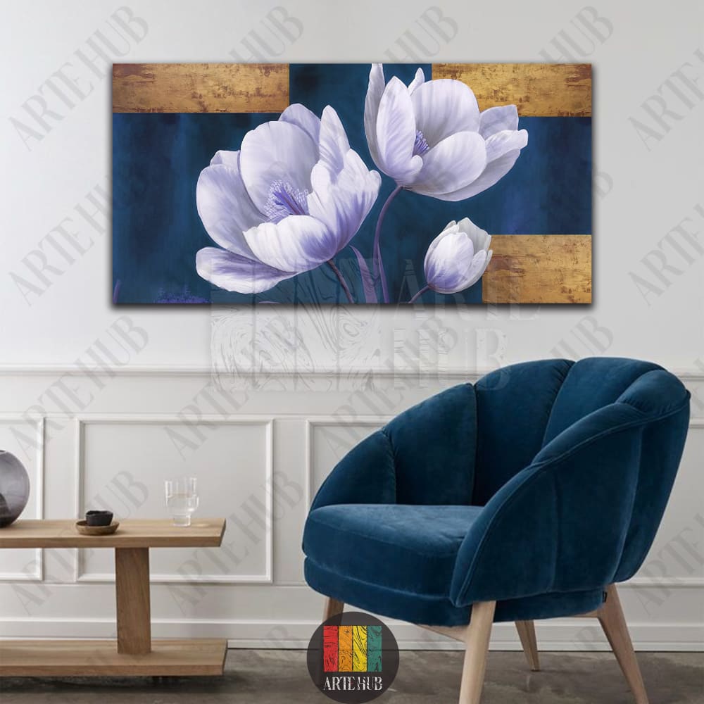 Large horizontal canvas wall art displaying white flowers with purple hints on a navy blue backdrop with gold metallic blocks in a modern room.