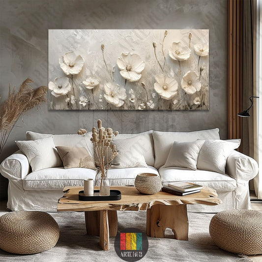 Textured 3D white floral canvas wall art hanging above a modern sofa in a luxury living room setting in Egypt.