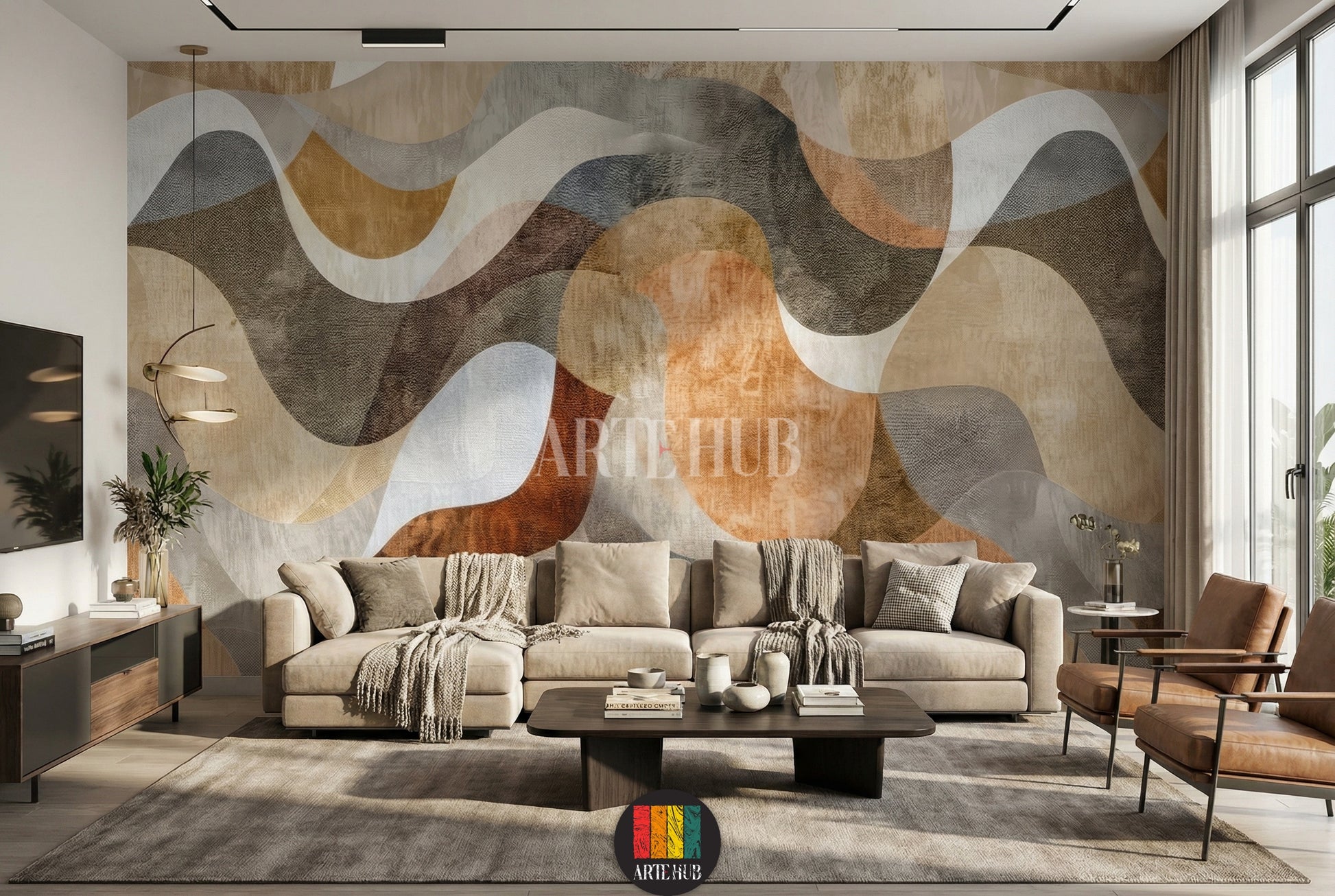 Full view of a modern living room featuring an abstract wavy pattern wallpaper in earthy tones of brown, beige, and grey. A neutral-colored L-shaped sofa with throw blankets and pillows sits against the wall. A dark wood coffee table with decor items, a TV unit, a floor lamp, and two brown leather armchairs are also visible, showcasing contemporary home decor in Egypt.
منظر كامل لغرفة معيشة عصرية تضم ورق حائط بتصميم أمواج تجريدية بألوان ترابية من البني والبيج والرمادي.  L بلون محايد 
room: living room