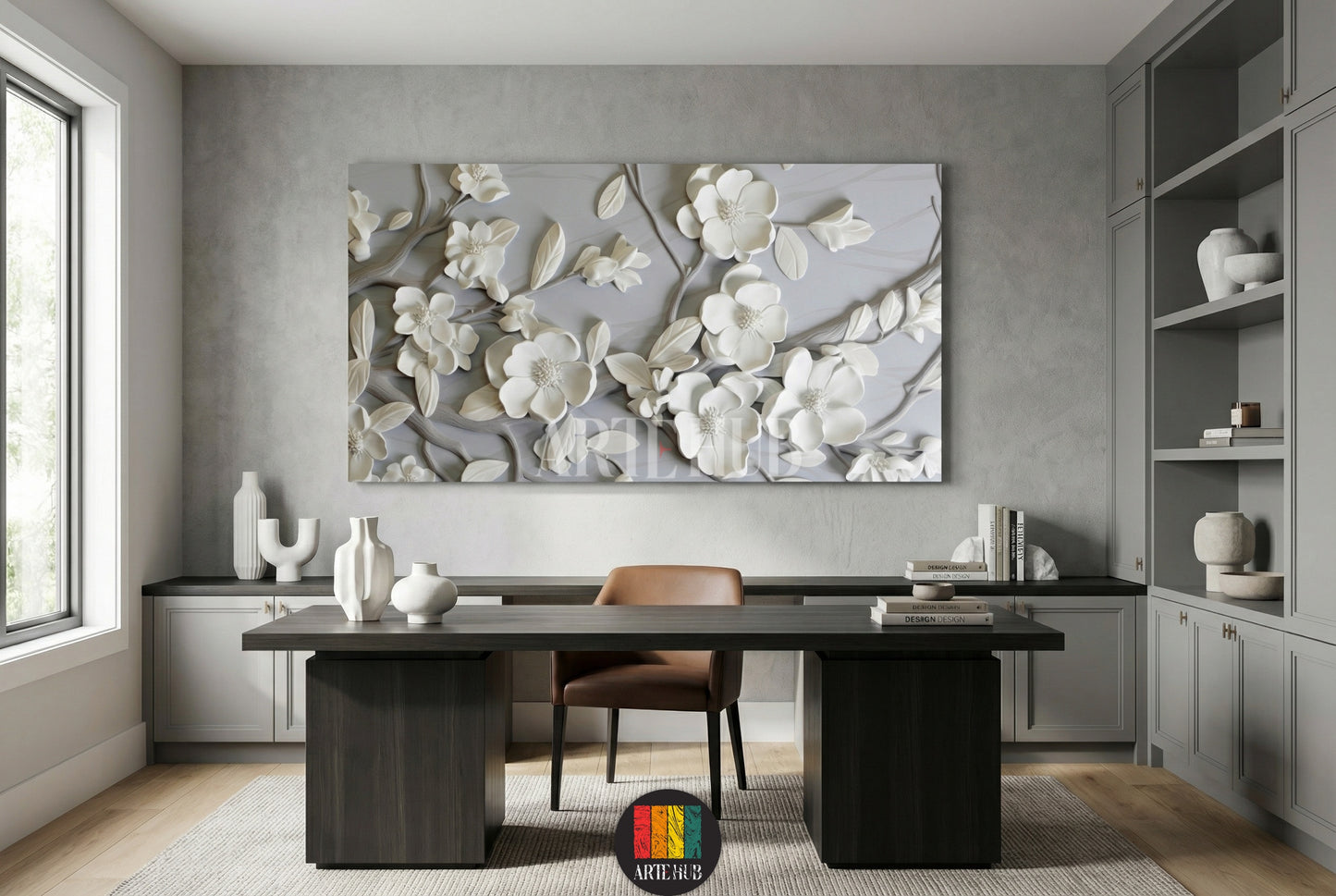 A premium 3D sculpted white magnolia floral canvas wall art hanging in a modern gray home office setting.