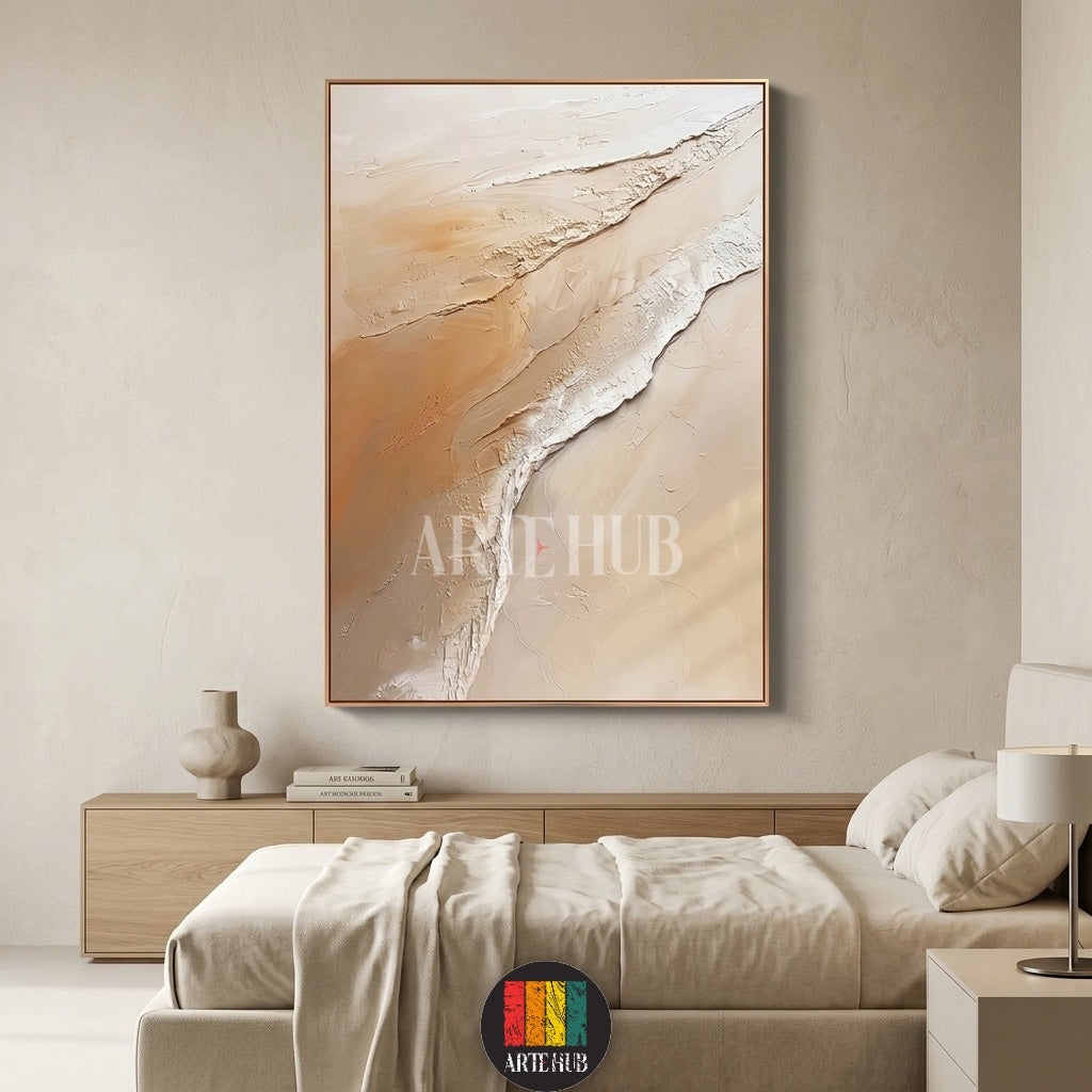 Hand-textured abstract canvas wall art with neutral sand and cream tones, framed and mounted in a contemporary luxury bedroom setting.
