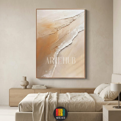 Hand-textured abstract canvas wall art with neutral sand and cream tones, framed and mounted in a contemporary luxury bedroom setting.