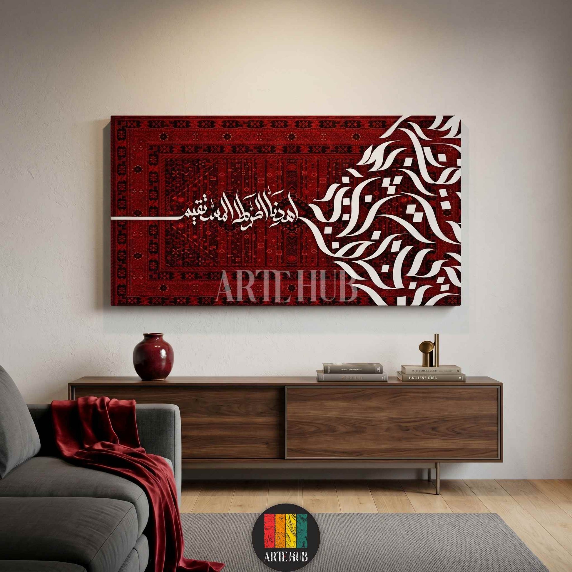 A luxury horizontal canvas wall art featuring elegant white Arabic calligraphy over a rich red traditional carpet pattern background in a modern room.