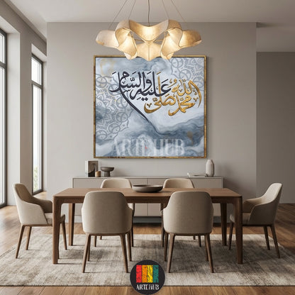 A large square canvas wall art featuring intricate Arabic calligraphy in gold and black over a gray marble background, styled in a luxury modern dining room.