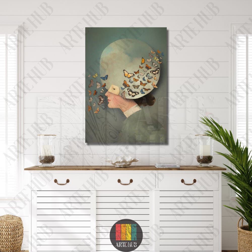 A surreal portrait canvas wall art piece featuring a woman with butterflies emerging from a celestial headpiece, styled for luxury Egyptian home decor.
