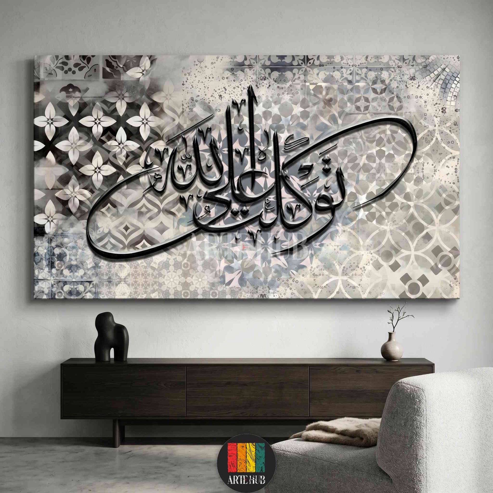 Modern horizontal canvas wall art featuring black Arabic calligraphy of 'Tawakal' over a grey and beige geometric tiled background in a luxury interior.